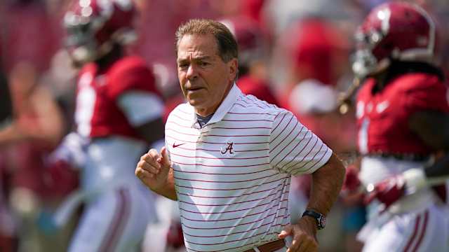 Alabama Crimson Tide head coach Nick Saban brings his team onto the field for warm ups prior to the game against Louisiana Monroe Warhawks at Bryant-Denny Stadium.